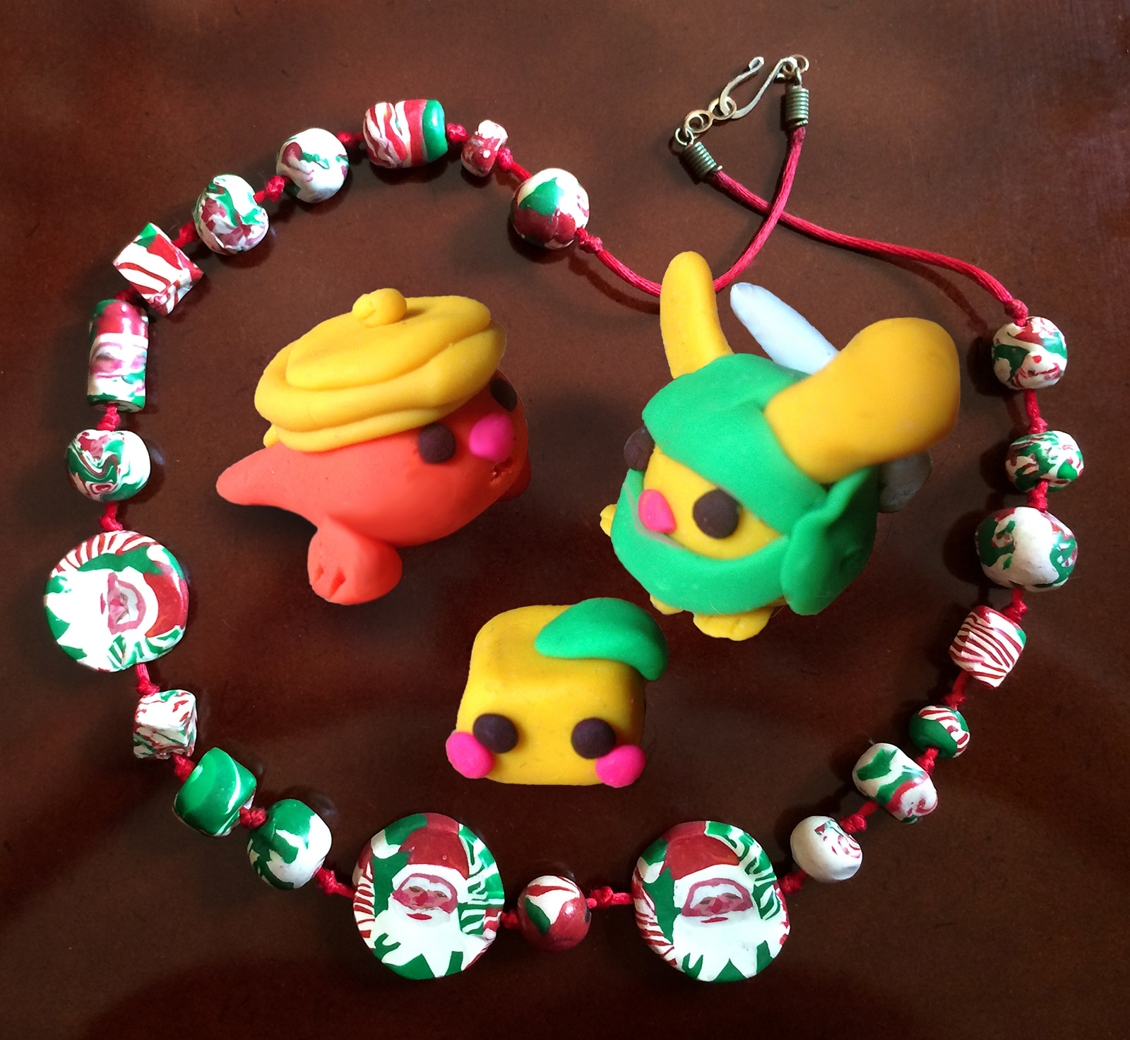 Clay figures and necklace