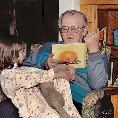 Jane's Grandpa reading to Jane and Gibbon