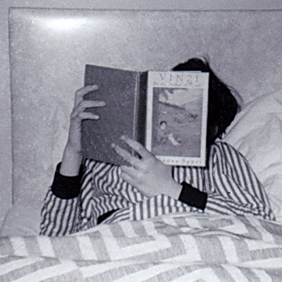 Me reading in bed