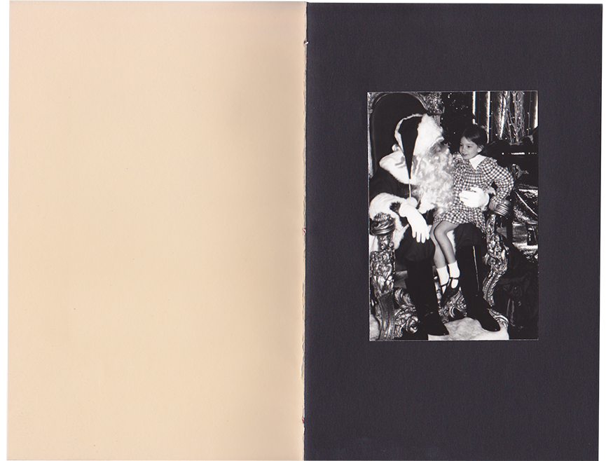The first page of the book is a photo of Jane on Santa's lap.