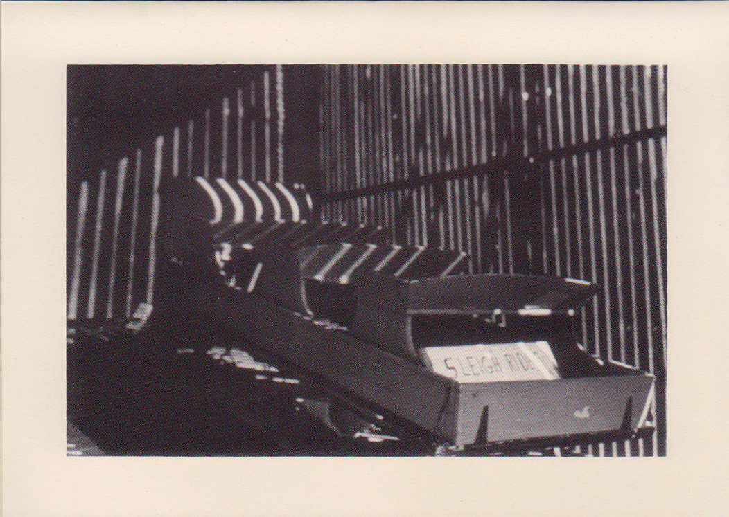 Photograph of a sleigh in a shed until winter