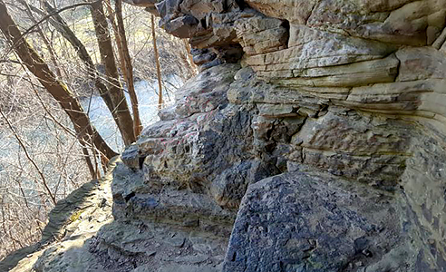 Natural seat in a cliff overlooking a creek