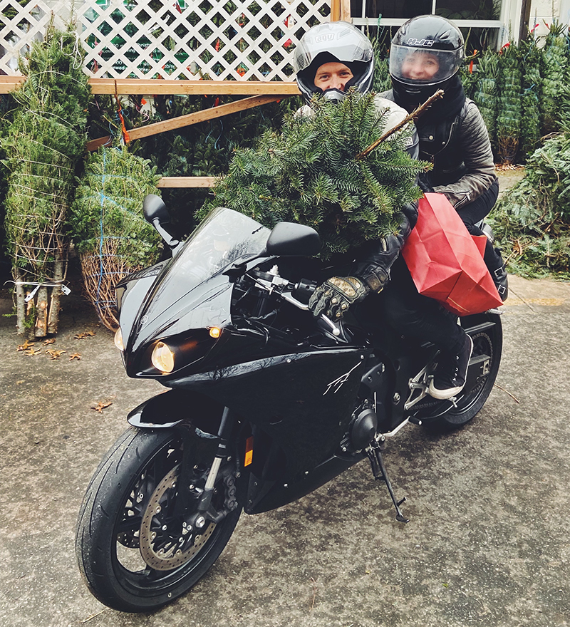 Ben and Jane on motorcycle with tree.