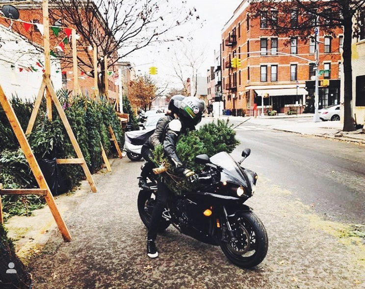 Ben and Jane on motorcycle with tree.