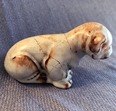 Ellen Jennings lion cub that has been broken and glued together