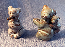 Two tiny Ellen Jennings bears, one with cigar and one mother with child