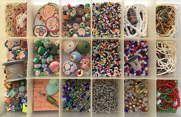 A box of beads sorted into partitions
