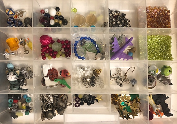 A box of beads sorted into partitions