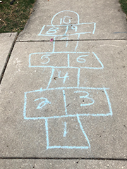 chalked hopscotch on sidewalk