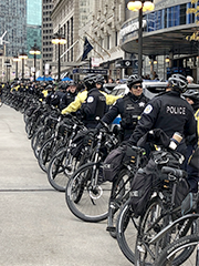 row of police officers with bicycles