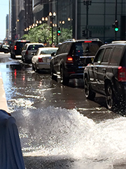 water in street with cars