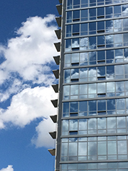 mirror-like tower reflecting clouds