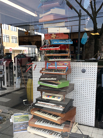 a stack of toy pianos