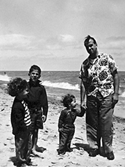 my sister, my brother, and me holding our father's hand by Lake Erie