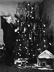 my maternal grandfather decorating a Christmas tree