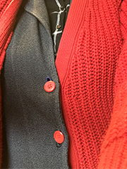 sweaters in layers that were accidently buttoned together