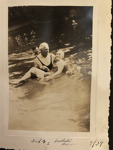 1939 photo of Arthur Stewart holding his wife Isabella in water