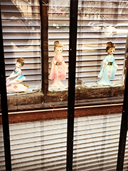 porcelain treasures in a garden apartment window