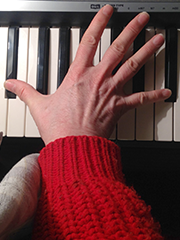 hand on piano keys