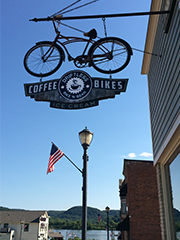 bicycle shot sign hanging from mounted bike above the door