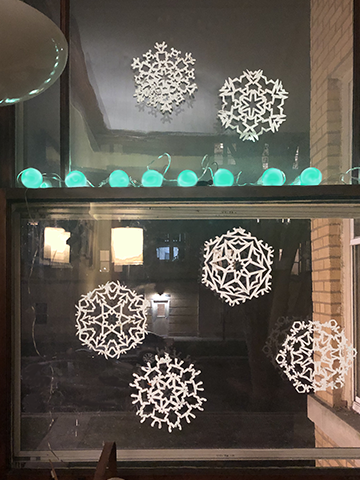 paper snowflakes in window