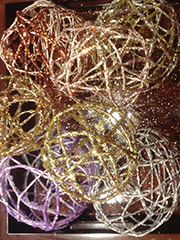 balls made by wrapping string around balloons and adding glitter