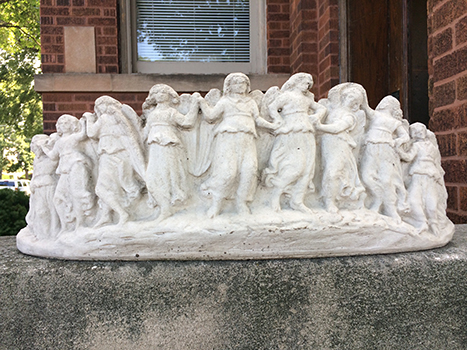 planter with dancing angels on the side