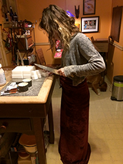 woman cutting soap with big knife
