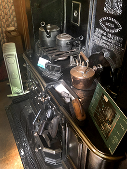 Antique stove with irons and pots