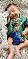 Infant in beautiful sweater.