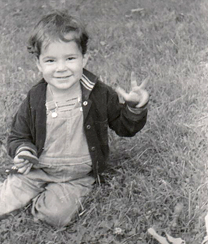 me as toddler in grass