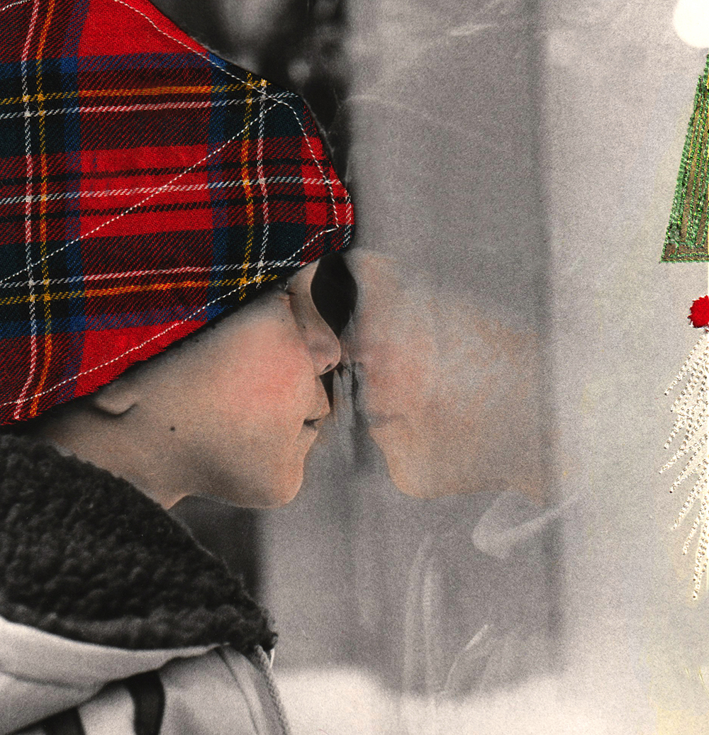 Child staring in Christmas department store window