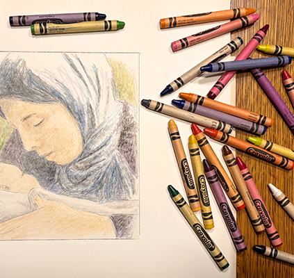 Crayons spread out with Mary drawing