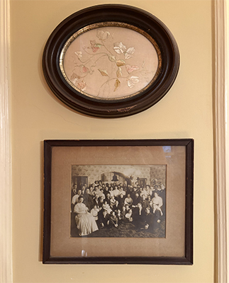 old photo and embroidery on wall