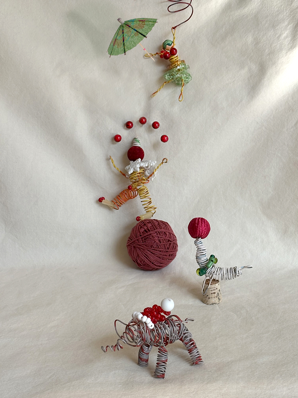 circus figures made of phone wire and beads